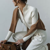 Blusa de punto con doble cremallera y cuello alto