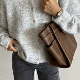 Chaleco vintage de punto gris claro con botones de concha