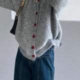 Cárdigan oversize con botones en forma de corazón y cuello redondo