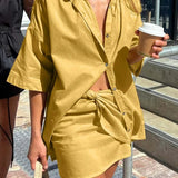 Miniconjunto de oficina de dos piezas en color amarillo con mangas cortas y sueltas.