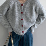 Cárdigan oversize con botones en forma de corazón y cuello redondo