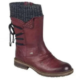 Botines de mujer – Corte entallado – Ribete de punto – Tachuelas decorativas – Cierre con cordones