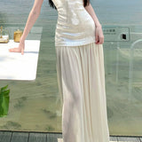 Vestido largo fluido sin tirantes con paneles de lentejuelas