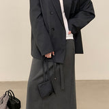 Blazer con cinturón estilo viajero