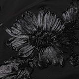 Vestido floral largo, sin espalda y con cierre de lazo.
