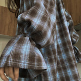 Blusa de cuadros de manga larga con cintura atada y cintura ajustada.