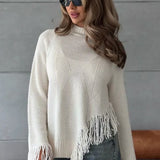 Blusa de punto asimétrica con flecos y cuello redondo