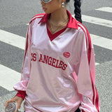 Blusa holgada de manga larga y cuello en V con estampado digital.
