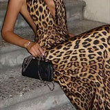 Vestido largo con estampado de leopardo, espalda descubierta, escote pronunciado y lazo.