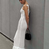 Vestido largo bohemio con volantes, en malla, sexy y transparente, con recortes.