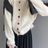 Cárdigan oversize con botones en forma de corazón y cuello redondo