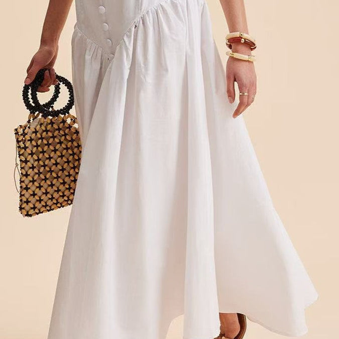 Elegante falda larga blanca con cintura alta y botones de patchwork.