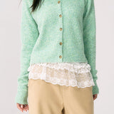 Cárdigan de punto verde chic y elegante con puños.