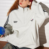 Sudadera retro con media cremallera y cuello alto