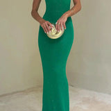 Vestido maxi ajustado, sexy y brillante, sin mangas y con espalda descubierta.
