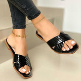 Sandalias planas de mujer – Acabado charol – Tiras cruzadas – Punta abierta cómoda