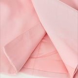 Blazer rosa con botones