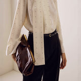 Blusa holgada con lunares y cintas, ideal para el día a día.