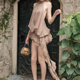 Minivestido fluido, asimétrico, con espalda descubierta y tirantes