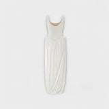 Maxi vestido con falda drapeada y abertura lateral
