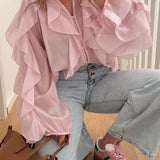 Blusa moderna con escote en V y volantes para uso diario.