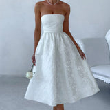 Vestido de noche trapecio sin tirantes en jacquard liso