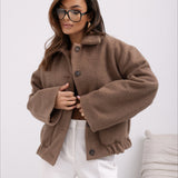 Abrigo de lana liso de moda con bolsillos elásticos y botones a presión.
