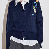 Blusa vintage de punto bordada con flores, estilo blusa floral.