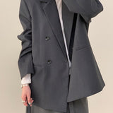 Blazer con cinturón estilo viajero