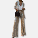 Conjunto de mujer: Chaqueta de lentejuelas estructurada y pantalones anchos de cintura alta.