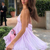 Minivestido sexy con escote en pico y lazo trapecio con volantes