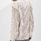 Blusa holgada con estampado floral y volantes
