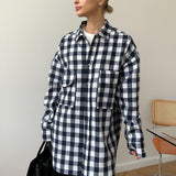 Blusa de cuadros de largo medio con bolsillos dobles