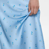 Falda drapeada de talle alto en satén con estampado floral