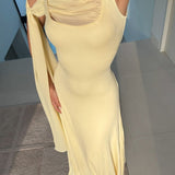 Elegante vestido largo con tirantes tipo chal y cinturón liso.