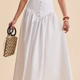 Elegante falda larga blanca con cintura alta y botones de patchwork.