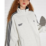 Sudadera retro con media cremallera y cuello alto