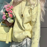 Blusa holgada con escote tipo jersey de punto floral