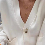 Abrigo de punto liso con cuello en V