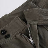 Pantalones cargo de mezclilla vintage con múltiples bolsillos y cintura media