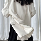 Blazer con espalda abierta y corte relajado