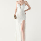 Vestido maxi sirena con lentejuelas y tirantes cruzados, escote en pico.