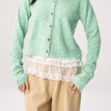 Cárdigan de punto verde chic y elegante con puños.