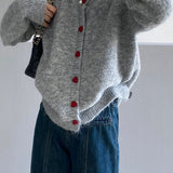 Cárdigan oversize con botones en forma de corazón y cuello redondo
