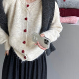 Cárdigan oversize con botones en forma de corazón y cuello redondo