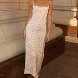 Vestido largo elegante con tirantes al descubierto y estampado floral.