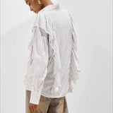 Blusa holgada con estampado floral y volantes