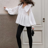 Blusa vintage con cuello bebé plisado y mangas abullonadas