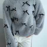 Suéter de mohair con pajarita, blusa holgada