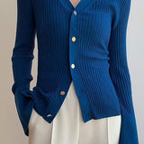 Elegante cárdigan azul de cuello en V en punto fino
